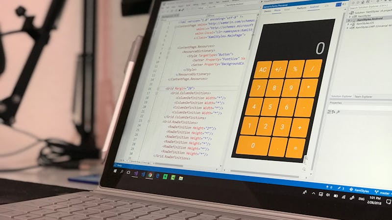Developer translating design mockups into production code