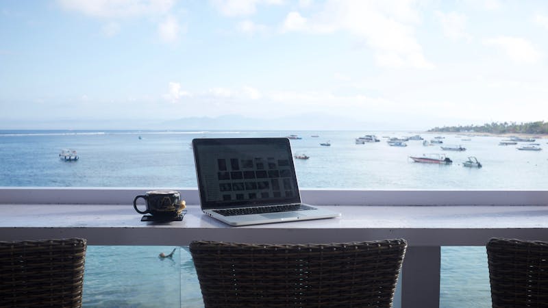 Digital nomad workspace setup with laptop and natural light