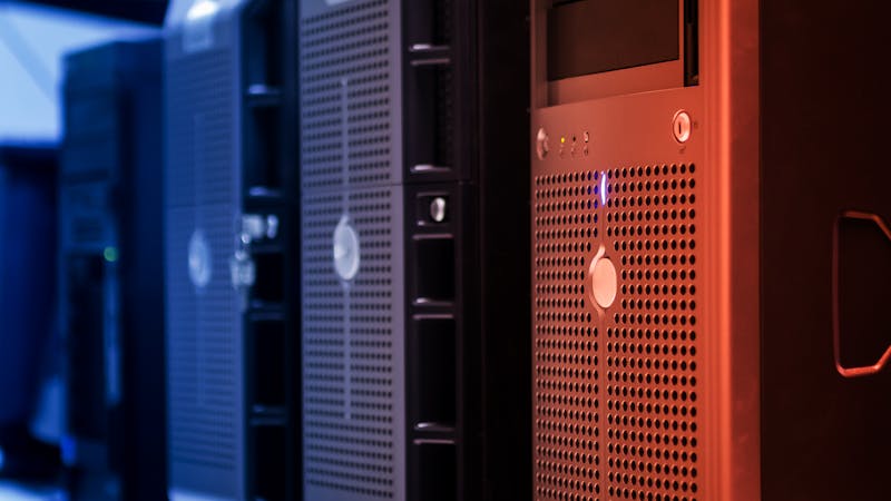 Row of server racks with blinking lights in a technology facility