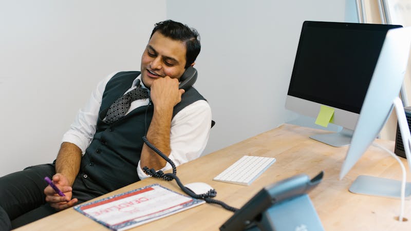 Professional on a discovery call in a modern office setting